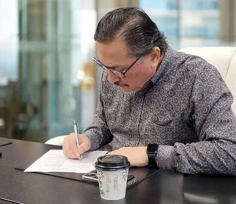 Commercial real estate client signing a contract in a downtown office